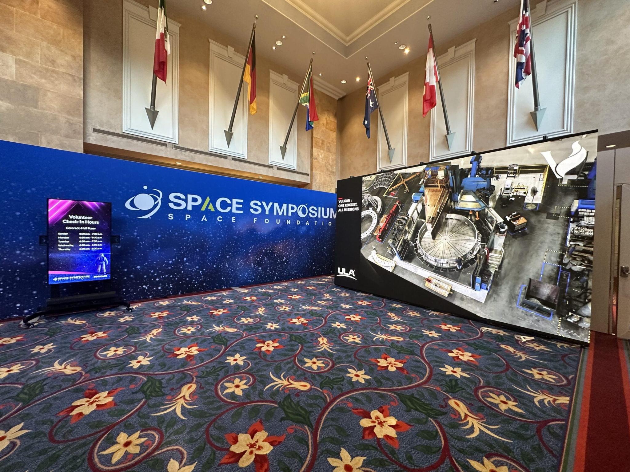 Space Symposium exhibit with large-format LED video walls